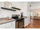 Close-up on a well-lit kitchen featuring white cabinets, granite countertops and modern appliances at 77 Glenn Se St, Atlanta, GA 30312