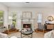 Inviting living room featuring a cozy fireplace and natural light from large windows at 77 Glenn Se St, Atlanta, GA 30312