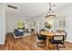 Open-concept living room with wood floors, modern lighting, and comfortable seating at 77 Glenn Se St, Atlanta, GA 30312