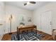 Office with a modern desk, stylish rug, and a three-bulb lamp for a comfortable work environment at 77 Glenn Se St, Atlanta, GA 30312