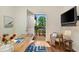 Cozy office space with outside access to a patio, comfortable chair, and mounted television at 77 Glenn Se St, Atlanta, GA 30312