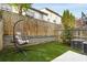 Backyard with a hanging chair, retaining wall, and artificial turf at 1356 Peter Haughton Nw Way, Atlanta, GA 30318