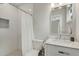 Bright bathroom featuring white subway tile, framed mirror, and a shower with a white curtain at 1356 Peter Haughton Nw Way, Atlanta, GA 30318