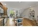 Open concept kitchen with hardwood floors, center island, and view of living room at 1356 Peter Haughton Nw Way, Atlanta, GA 30318