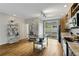 Open concept kitchen with hardwood floors, center island, and sliding glass doors at 1356 Peter Haughton Nw Way, Atlanta, GA 30318