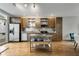Stylish kitchen with stainless steel appliances, center island, and hardwood floors at 1356 Peter Haughton Nw Way, Atlanta, GA 30318