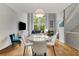 Open living area with hardwood floors, modern furniture, and large windows at 1356 Peter Haughton Nw Way, Atlanta, GA 30318
