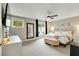 Bright main bedroom with a large bed, windows, and decoratively appointed interior at 1356 Peter Haughton Nw Way, Atlanta, GA 30318