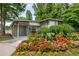 Poolside cabana surrounded by vibrant flower beds and greenery at 1356 Peter Haughton Nw Way, Atlanta, GA 30318