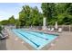 Inviting pool area surrounded by lush landscaping and lounge chairs at 1356 Peter Haughton Nw Way, Atlanta, GA 30318