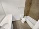 Bathroom features shower over tub, sink with vanity and ceramic tile at 165 N River Dr # B, Atlanta, GA 30350