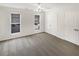 Bright bedroom features neutral walls, carpet, two windows with blinds, and a double-door closet at 165 N River Dr # B, Atlanta, GA 30350