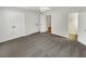 A well-lit bedroom boasts neutral walls, carpet, ceiling fan, and access to a bathroom and closet at 165 N River Dr # B, Atlanta, GA 30350