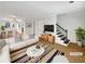 Bright living room featuring modern decor, hardwood floors and contemporary furnishings at 165 N River Dr # B, Atlanta, GA 30350