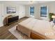 Inviting primary bedroom with neutral decor, hardwood floors, and ample natural light at 165 N River Dr # B, Atlanta, GA 30350