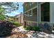 Back exterior of home featuring a mix of green and light-brown horizontal siding at 4035 Regal Oaks Dr, Suwanee, GA 30024