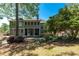 Back exterior view of home featuring two stories and landscaped yard at 4035 Regal Oaks Dr, Suwanee, GA 30024