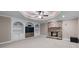Basement room with stone fireplace and built in shelving at 4035 Regal Oaks Dr, Suwanee, GA 30024