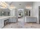Bathroom with double vanity, decorative mirrors and lighting, and a tile floor at 4035 Regal Oaks Dr, Suwanee, GA 30024