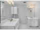 Bright bathroom featuring double sinks, vanity, and ample storage space at 4035 Regal Oaks Dr, Suwanee, GA 30024