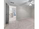 Cozy bedroom with neutral tones, ceiling fan, and a view into the hallway at 4035 Regal Oaks Dr, Suwanee, GA 30024