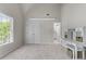 Bright bedroom featuring a large window, desk, and a double-door closet at 4035 Regal Oaks Dr, Suwanee, GA 30024