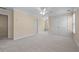 An expansive bedroom with neutral tones, a ceiling fan, and a double door closet at 4035 Regal Oaks Dr, Suwanee, GA 30024
