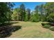 Enjoy the vast and well-maintained community lawn with ample space for activities and relaxation at 4035 Regal Oaks Dr, Suwanee, GA 30024