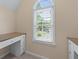 Comfortable desk area with built-in storage, a large window, and natural light at 4035 Regal Oaks Dr, Suwanee, GA 30024