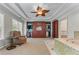 Dressing room with built-in wardrobe, closet organizers, lots of natural light, and an armchair at 4035 Regal Oaks Dr, Suwanee, GA 30024