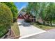 Well-maintained home with a long driveway and a lovely red brick facade at 4035 Regal Oaks Dr, Suwanee, GA 30024