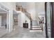 Spacious foyer with a grand staircase and elegant tile flooring at 4035 Regal Oaks Dr, Suwanee, GA 30024