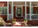 Inviting entryway with potted flowers and a covered front porch at 4035 Regal Oaks Dr, Suwanee, GA 30024