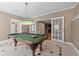 Game room with pool table, unique floors, and double doors to another room at 4035 Regal Oaks Dr, Suwanee, GA 30024