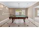 Game room with pool table, ceiling fan, and unique flooring at 4035 Regal Oaks Dr, Suwanee, GA 30024