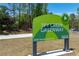 Ivy Creek Greenway sign with Gwinnett Trails logo on a sunny day at 4035 Regal Oaks Dr, Suwanee, GA 30024
