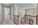 Upstairs hallway with views of the entryway and a bedroom at 4035 Regal Oaks Dr, Suwanee, GA 30024