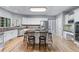 Modern kitchen featuring stainless steel appliances, white cabinets, and granite countertops at 4035 Regal Oaks Dr, Suwanee, GA 30024