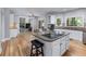 Gourmet kitchen boasts stainless appliances, granite counters, and hardwood flooring at 4035 Regal Oaks Dr, Suwanee, GA 30024