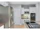 Close up view of a modern kitchen featuring stainless steel appliances and granite countertops at 4035 Regal Oaks Dr, Suwanee, GA 30024