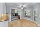 Bright kitchen featuring granite counters, wooden floors and a doorway to the backyard at 4035 Regal Oaks Dr, Suwanee, GA 30024