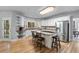 Bright, spacious kitchen featuring modern appliances, white cabinetry, and hardwood floors at 4035 Regal Oaks Dr, Suwanee, GA 30024