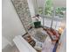 Upstairs view of the living room showcasing the stone fireplace and view of the yard at 4035 Regal Oaks Dr, Suwanee, GA 30024