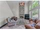 Spacious living room features a stone fireplace, tile floors and high windows at 4035 Regal Oaks Dr, Suwanee, GA 30024