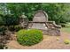 Stone park entrance sign with lush greenery and well-maintained landscaping at 4035 Regal Oaks Dr, Suwanee, GA 30024