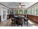 Sunroom with a ceiling fan, tile floors, and many windows at 4035 Regal Oaks Dr, Suwanee, GA 30024