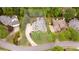 An aerial view of the property and its lush green surroundings, framed by a yellow outline at 454 Langley Oaks Dr, Marietta, GA 30067