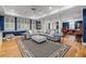 Finished basement featuring hardwood floors, ample seating, and a decorative patterned rug at 454 Langley Oaks Dr, Marietta, GA 30067