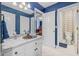 Bathroom with dual vanity, granite countertop, and tile flooring with decorative mirror at 454 Langley Oaks Dr, Marietta, GA 30067