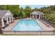 Community pool area with ample lounge chairs, gazebos, and a well-maintained pool at 454 Langley Oaks Dr, Marietta, GA 30067